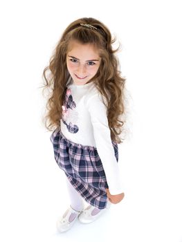 Portrait of a beautiful little girl looking from above. The concept of happy people, childhood. Isolated on white background.