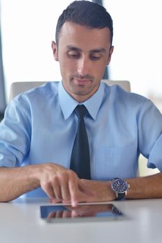 close-up of human hand  business man using tablet compuer at office