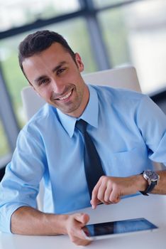 close-up of human hand  business man using tablet compuer at office