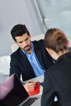 Group of happy young  business people in a meeting at office