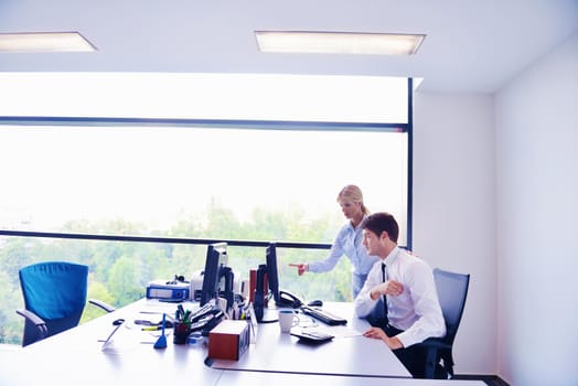 Group of happy young  business people in a meeting at office