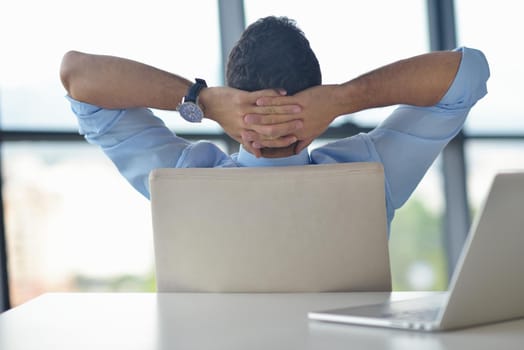 happy young business  man work in modern office on computer