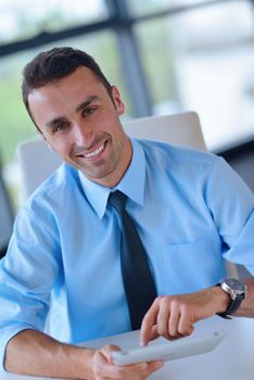 close-up of human hand  business man using tablet compuer at office