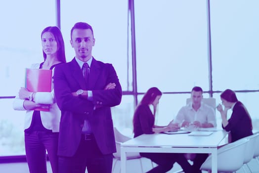 Group of happy young  business people in a meeting at office