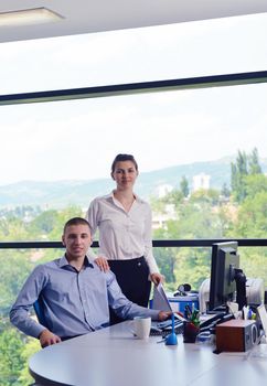 Group of happy young  business people in a meeting at office