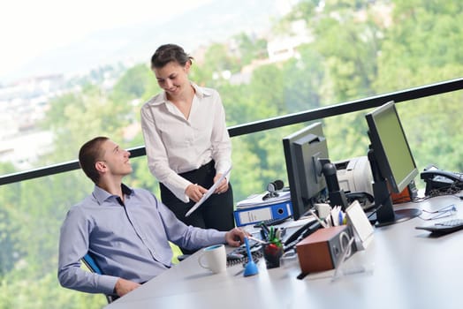 Group of happy young  business people in a meeting at office