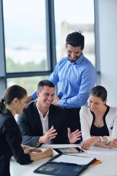 Group of happy young  business people in a meeting at office