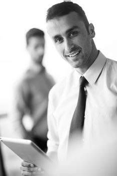 close-up of human hand  business man using tablet compuer at office