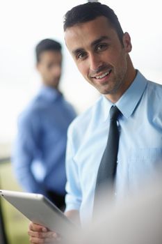 close-up of human hand  business man using tablet compuer at office