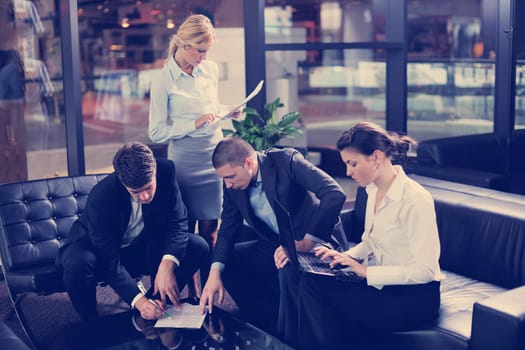 Group of happy young  business people in a meeting at office