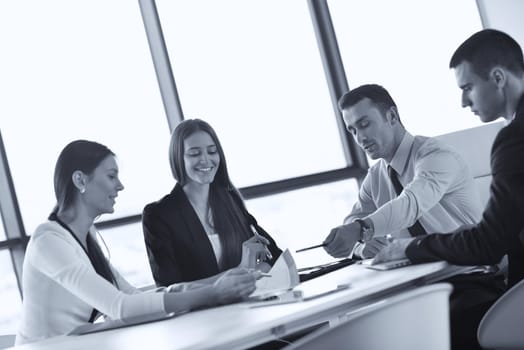 Group of happy young  business people in a meeting at office