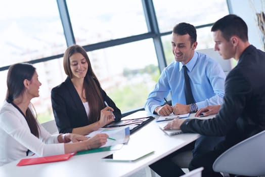 Group of happy young  business people in a meeting at office