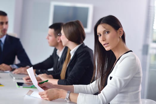 Group of happy young  business people in a meeting at office