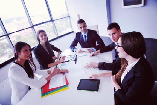 Group of happy young  business people in a meeting at office