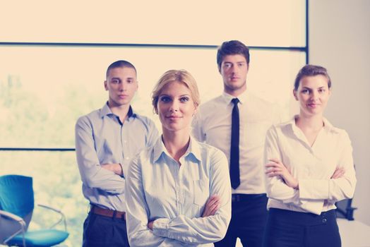 business woman  with her staff,  people group in background at modern bright office indoors