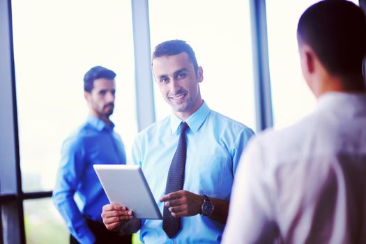 close-up of human hand  business man using tablet compuer at office