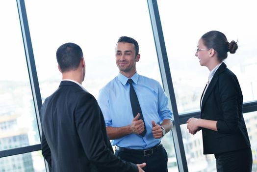 Group of happy young  business people in a meeting at office