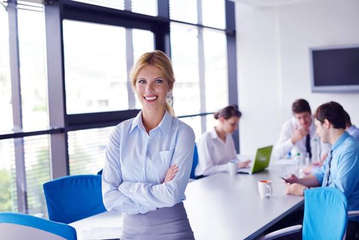 business woman  with her staff,  people group in background at modern bright office indoors