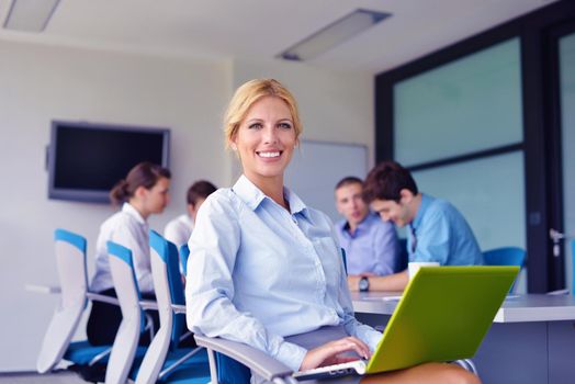 business woman  with her staff,  people group in background at modern bright office indoors