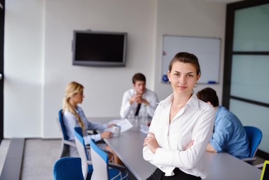 business woman  with her staff,  people group in background at modern bright office indoors