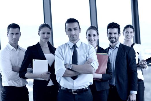 Group of happy young  business people in a meeting at office