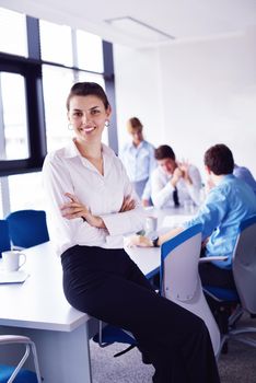 business woman  with her staff,  people group in background at modern bright office indoors