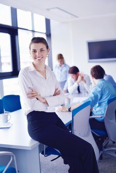 business woman  with her staff,  people group in background at modern bright office indoors