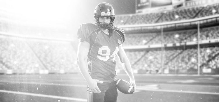 American Football Player isolated on big modern stadium field with lights and flares