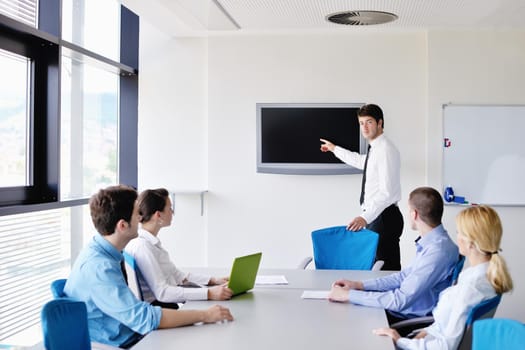 Group of happy young  business people in a meeting at office