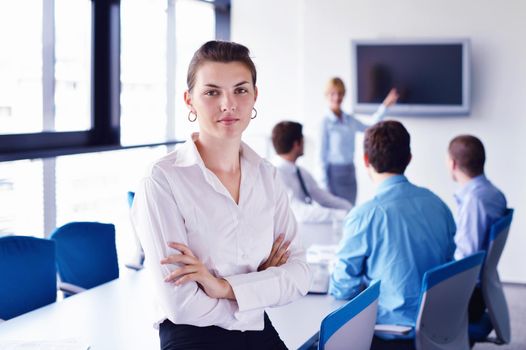 business woman  with her staff,  people group in background at modern bright office indoors