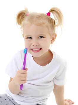 Cute little girl brushing her teeth. She uses a toothbrush. The concept of healthy teeth, hygiene, dentistry. Isolated on white background.