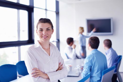 business woman  with her staff,  people group in background at modern bright office indoors