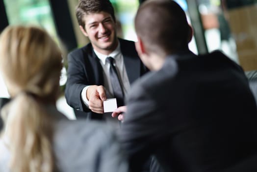 Group of happy young  business people in a meeting at office