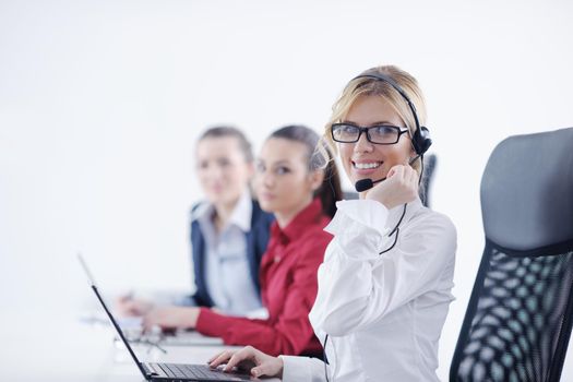 Pretty young business woman group with headphones smiling at you against white background