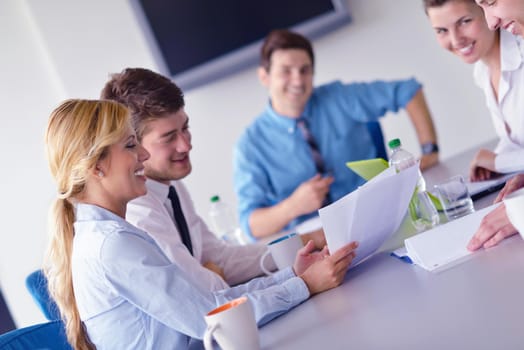 Group of happy young  business people in a meeting at office