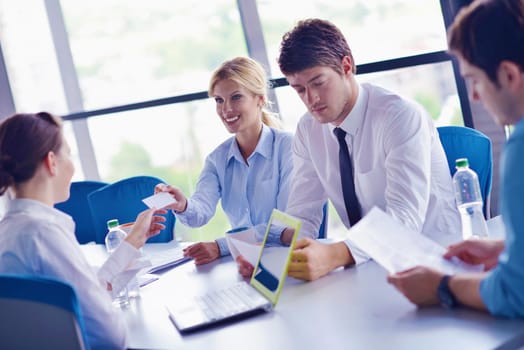 Group of happy young  business people in a meeting at office