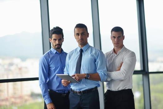 Group of happy young  business people in a meeting at office