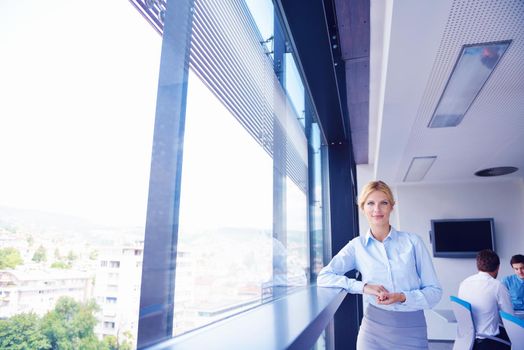 business woman  with her staff,  people group in background at modern bright office indoors