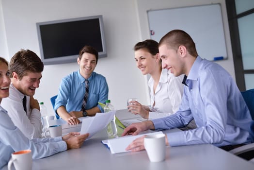 Group of happy young  business people in a meeting at office