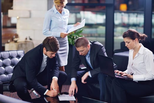 Group of happy young  business people in a meeting at office