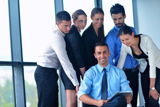 Group of happy young  business people in a meeting at office