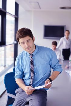 Group of happy young  business people in a meeting at office