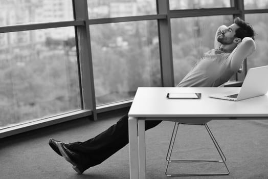 happy young business  man work in modern office on computer