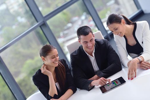 Group of happy young  business people in a meeting at office