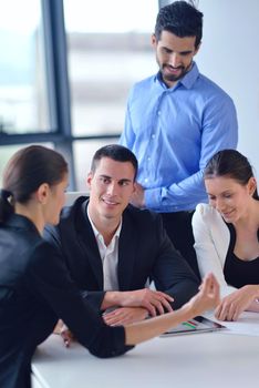 Group of happy young  business people in a meeting at office