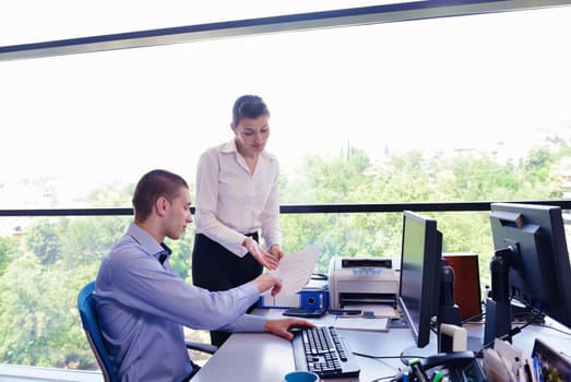 Group of happy young  business people in a meeting at office