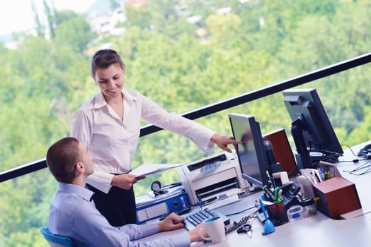 Group of happy young  business people in a meeting at office