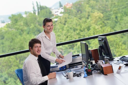 Group of happy young  business people in a meeting at office