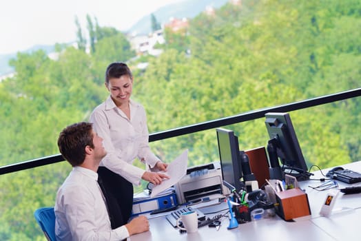 Group of happy young  business people in a meeting at office