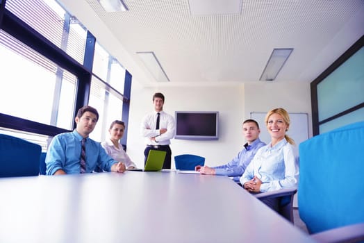 Group of happy young  business people in a meeting at office